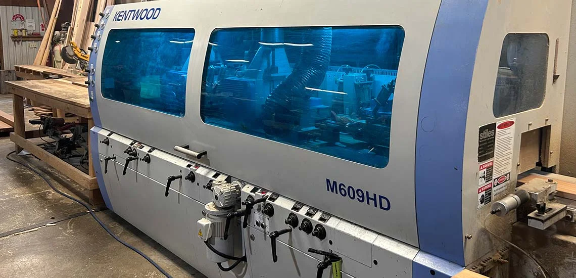 Blue Kentwood M609HD moulder set up on the mill floor
