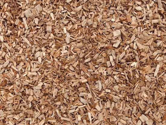 Pale natural wood chips filling the frame
