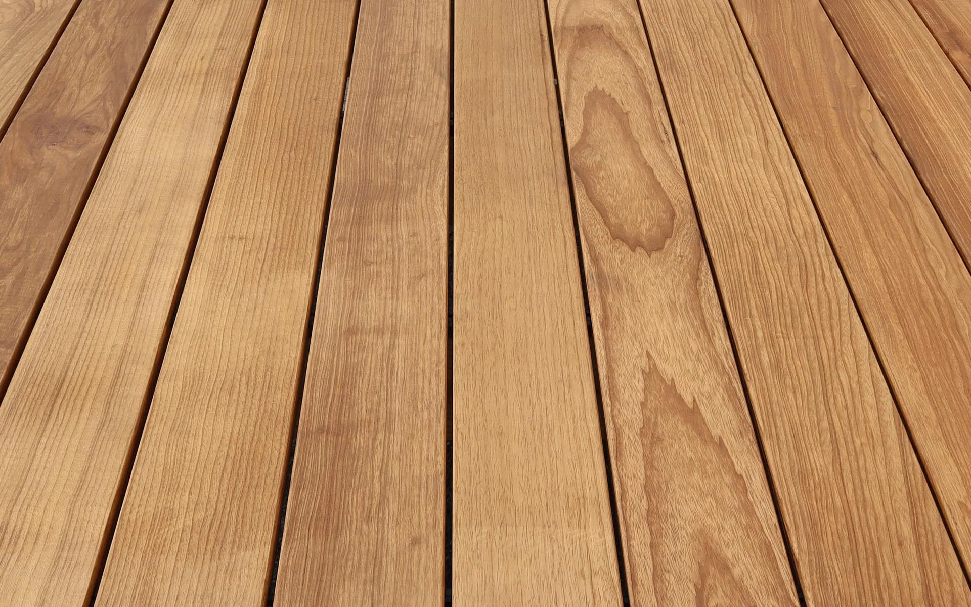 Tan deck boards converging toward the horizon in even light